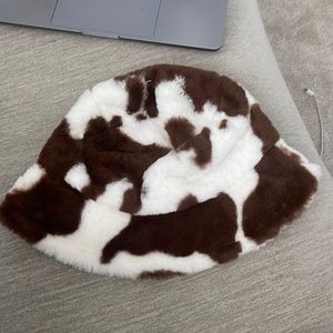 Urban outfitters cow patterned fuzzy hat